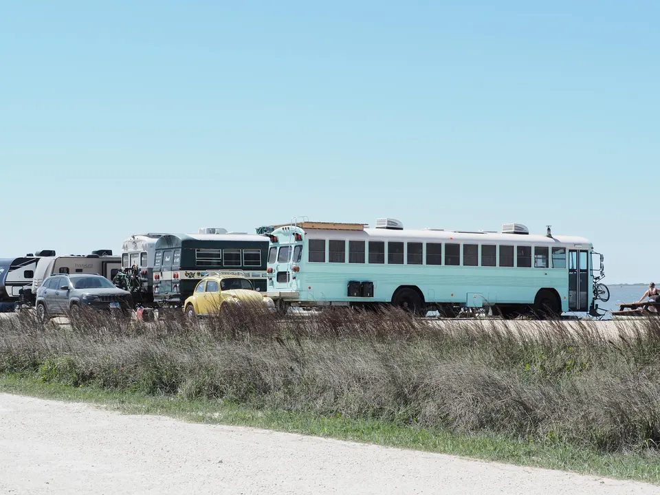 Converted Schoolies parked at BIB CG