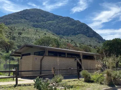 Main restroom located near the RV campsites. There is a dish washing station to the left side of the building and a water bottle filling station inside front door.