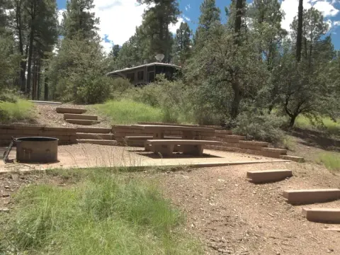 Site 35 Three Stairs To The Cement Platform With A Cement Table And Metal Fire Ring, Six Stairs To Parking and Toilet, No Handrail