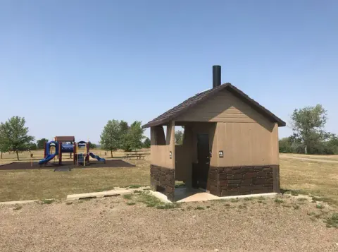 Bathroom facilities near playground at Wolf Creek Campground on Lake Sakakawea