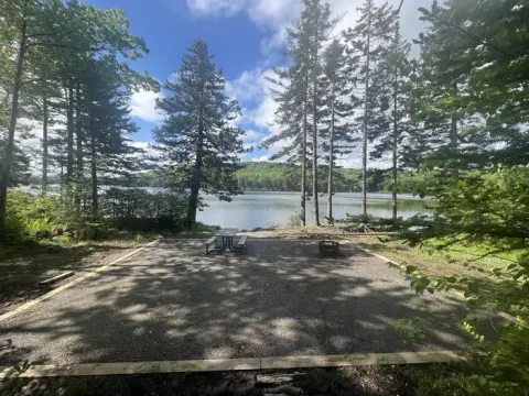 pond with picnic table in foreground