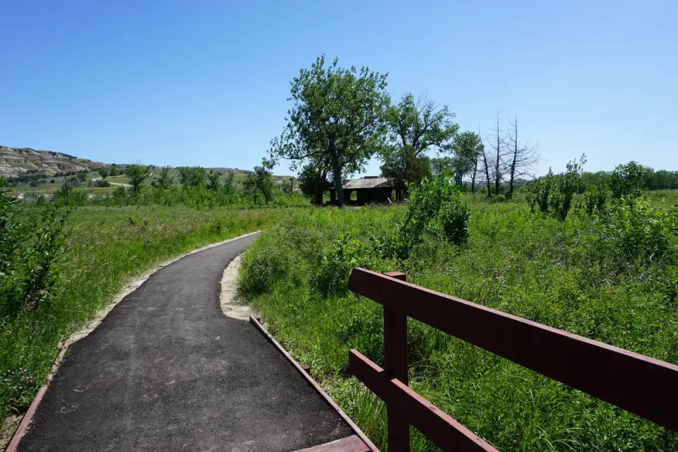 Bridge and blacktopped trail.
