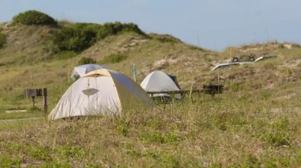 Tents nestled in dunes