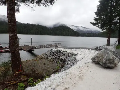 floating dock with ramp and view of ocean