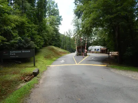 The entry gate and kiosk surrounded by forest as you enter the campground.