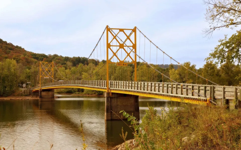 Scenic view of Beaver Bridge over tranquil waters in fall.