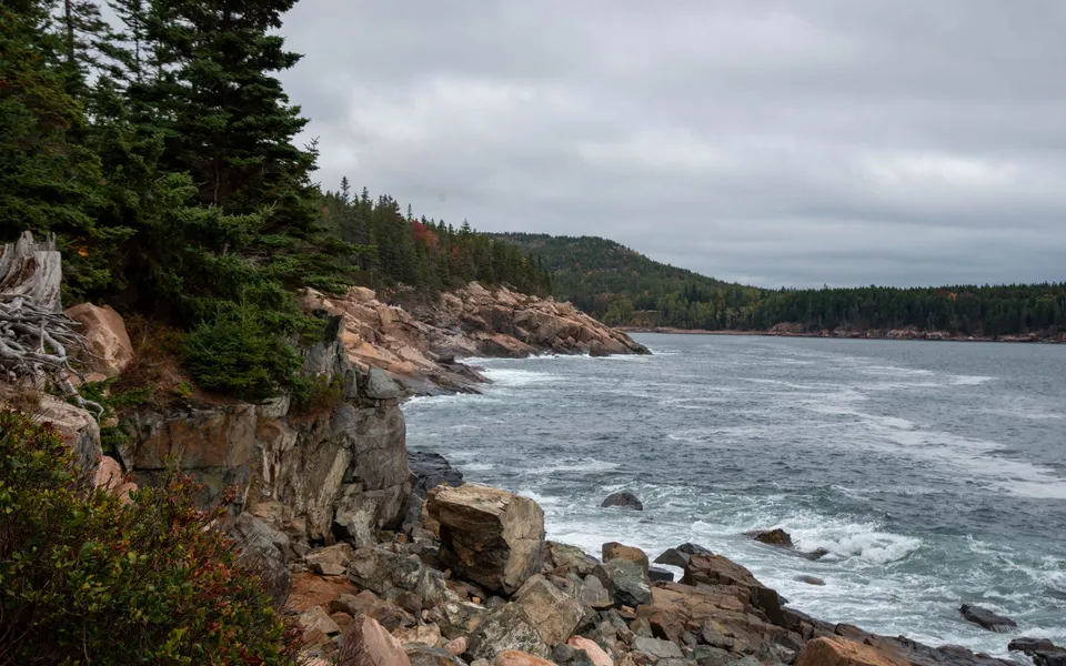 Stunning view of the rocky coastline in Acadia National Park, Maine, during fall.